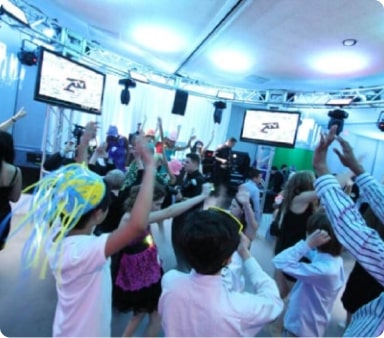 Guests dancing with toys and hats