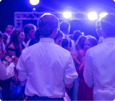 School kids gathered in a crowd dancing